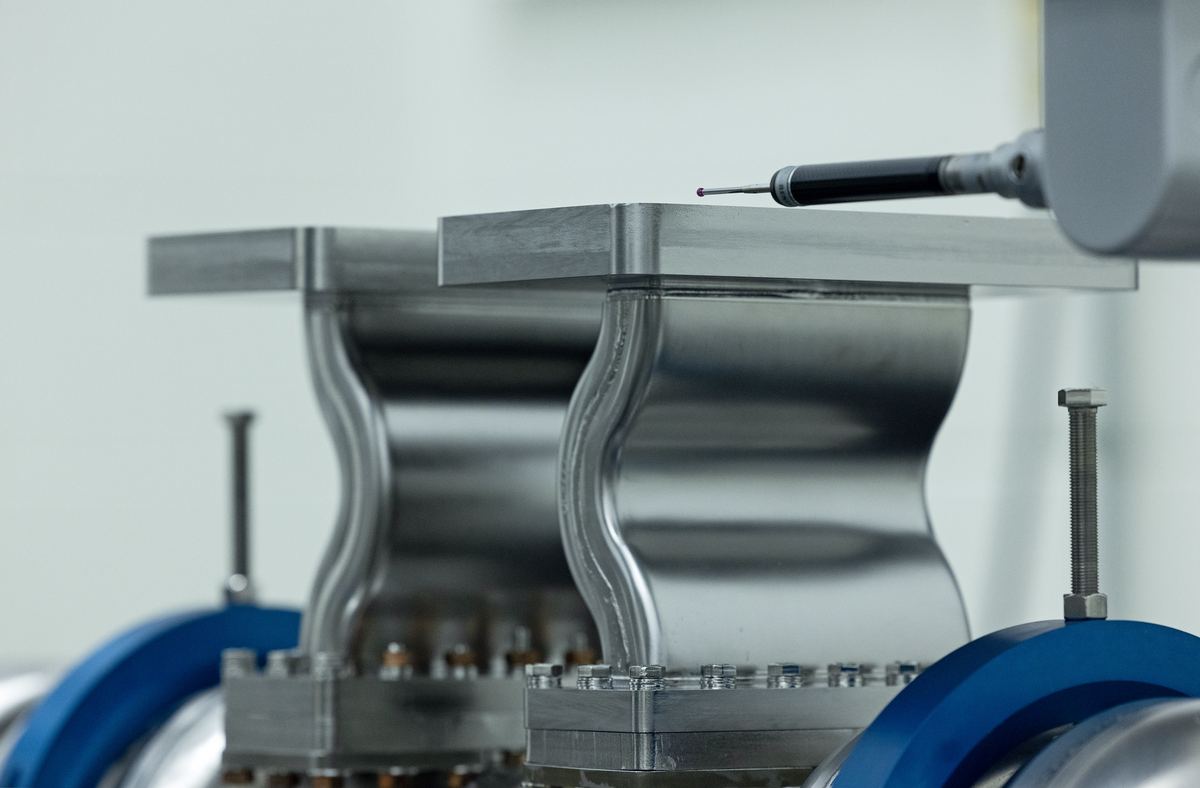 CMM stylus probing the surface of a machined component